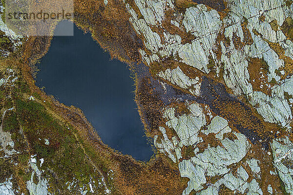 Switzerland  Graubunden Canton  Aerial view of small alpine lake in San Bernardino Pass area