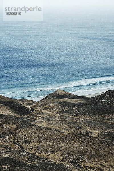 Volcanic landscape in front of sea at Fuerteventura
