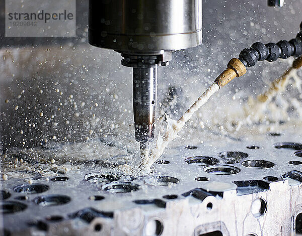 Close-up of CNC machine cutting metal in factory