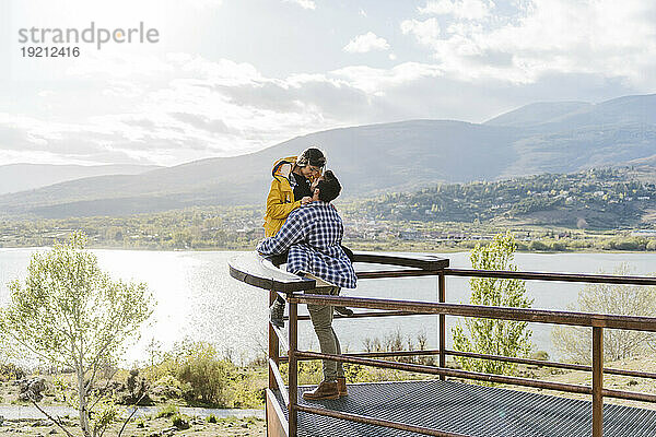 Romantic couple spending leisure time near observation point
