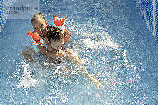 Friends having fun in swimming pool