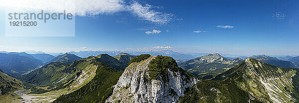 Austria  Salzburger Land  Drone panorama of summit cross on Gruberhorn mountain