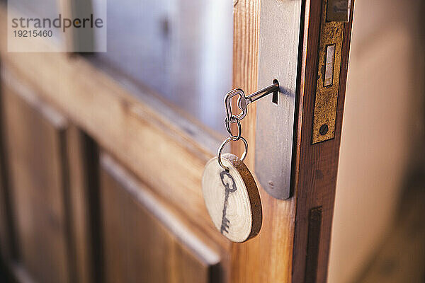 Key hanging on wooden door