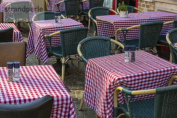 Empty restaurant tables on the terrace