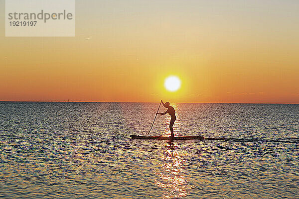 France  Baie de Bourgneuf  44  sunset  man paddling.