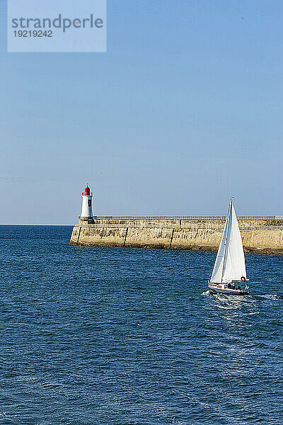 France  Les Sables d'Olonne  85  sailboat taking to the sea through the channel.