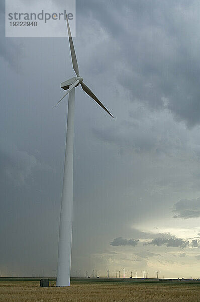Wind turbine under a stormy sky in southwest Kansas; Liberal  Kansas  United States of America