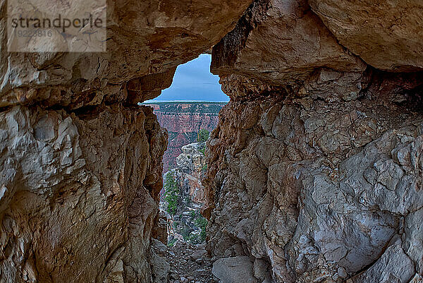 A gap between a stack of balanced boulders on a cliff east of Grandview Point at Grand Canyon South Rim  Grand Canyon National Park  UNESCO World Heritage Site  Arizona  United States of America  North America