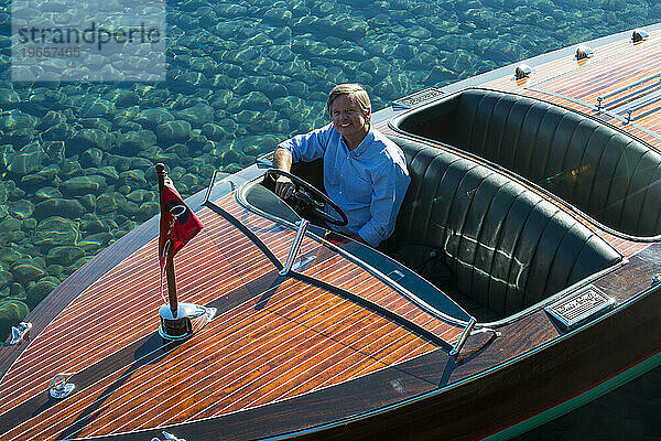 Man driving motorboat on Lake Tahoe  California  USA