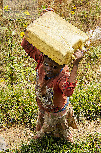 Girl hauling water in Rwanda