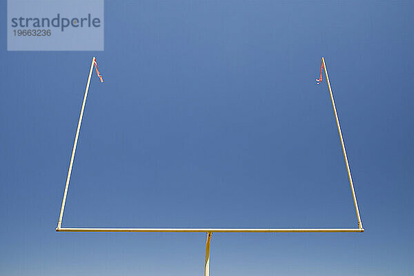 The upright shilouette of the scoring area of Football field goal posts on a sports field