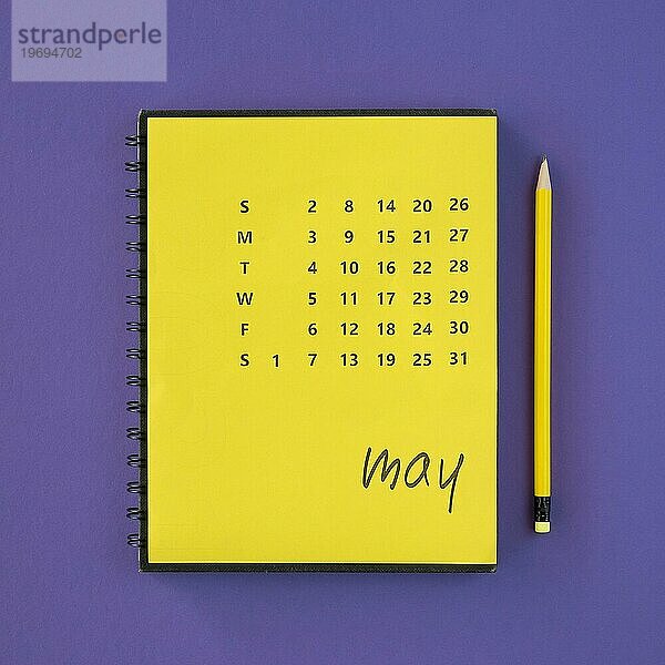 Draufsicht gelber Kalender Bleistift