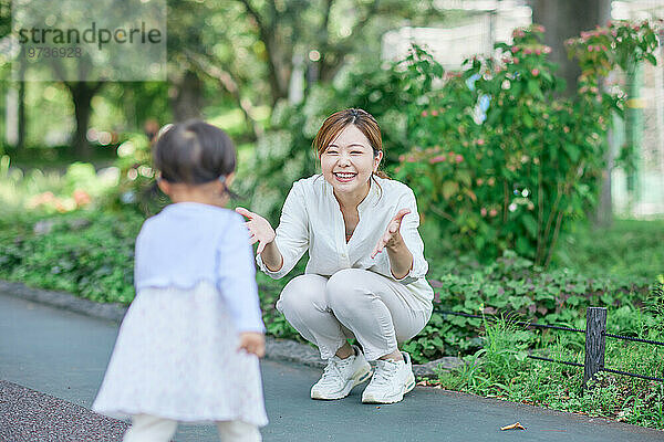 Japanese woman playing with her daughter