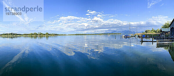 Reflection of clouds over Lake Chiemsee in Bavaria  Germany