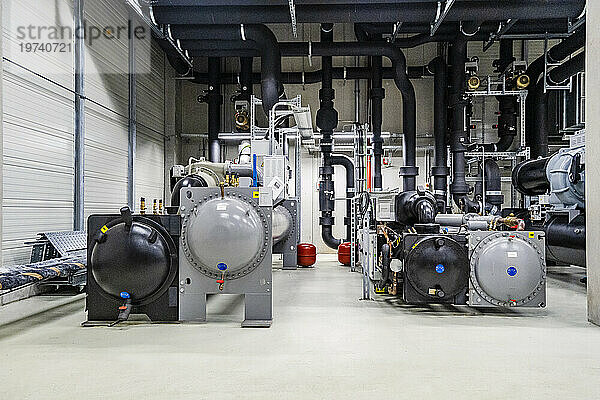 Machines and pipework in a factory for energy distribution