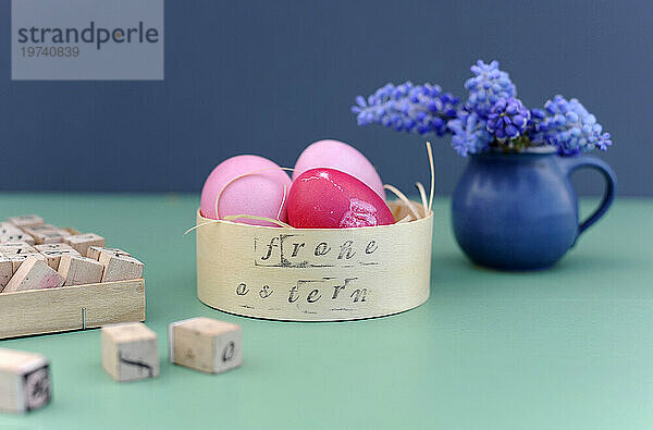 Studio shot of pink Easter eggs in box