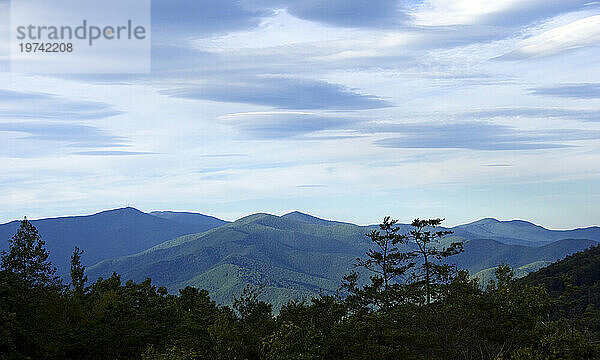 Lenticular clouds form over mountains along the Blue Ridge Pkwy  from left to right; Clingman's Peak  Mt. Mitchell  The Seven Sisters  Black Mountains; North Carolina  United States of America