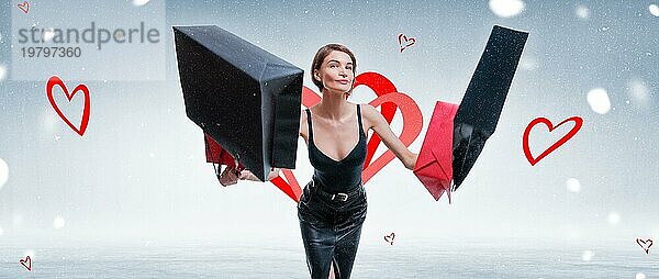 Glückliche Frau springt vor Freude mit Handwerk Taschen. Konzept für den Valentinstag.