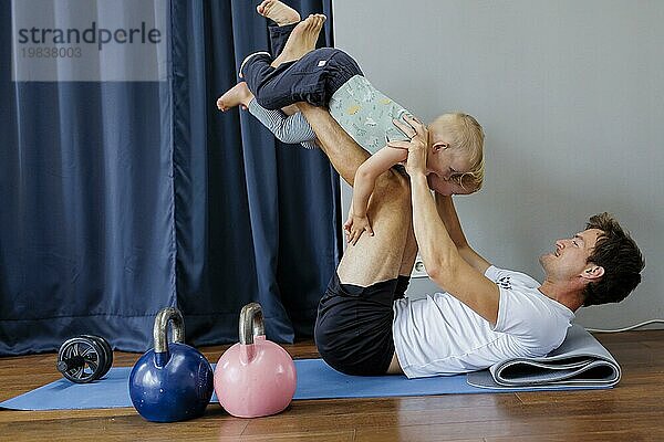 Topic: Father doing gymnastics with children