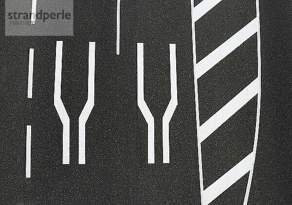 Road narrowing markings on asphalt road