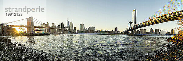 Famous bridges connecting Manhattan skyline to Dumbo district  New York City
