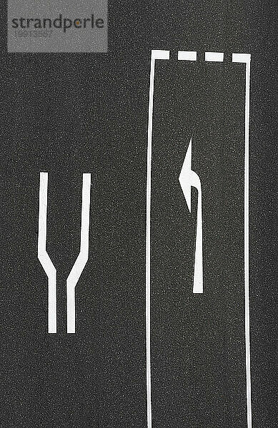 Left turn road marking on asphalt road