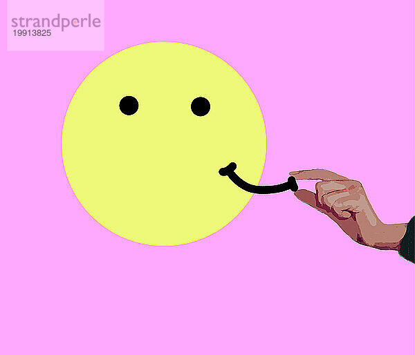 Hand placing or removing smile on anthropomorphic smiley face