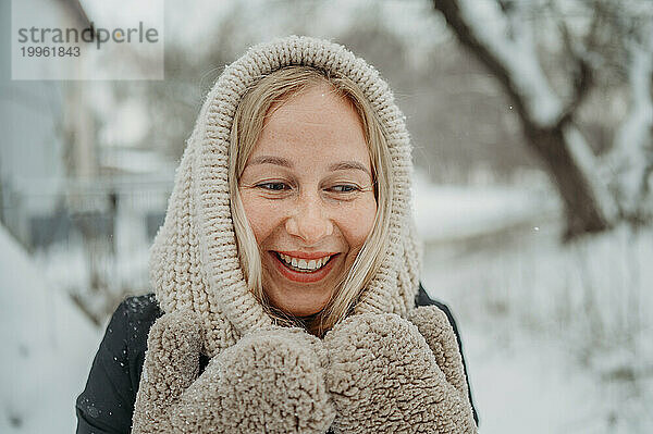 Smiling young woman in winter
