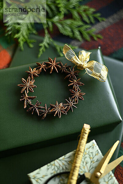 Wrapped presents and DIY Christmas decoration made of star anise