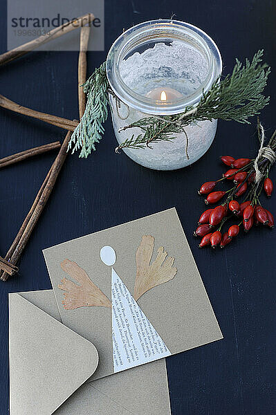 Rose hips  burning candle and DIY Christmas cards