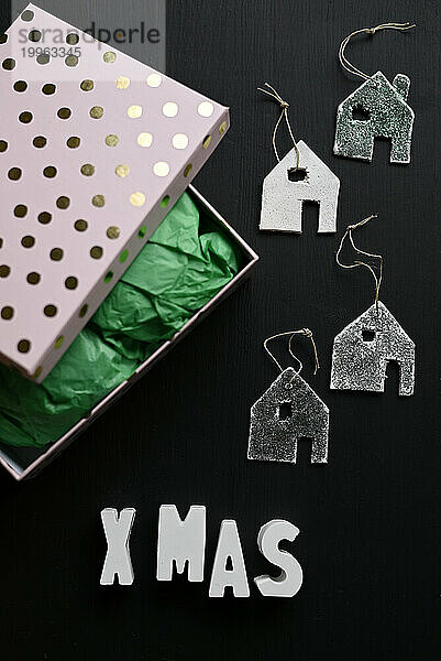 Studio shot of spotted box and DIY house shaped decorations