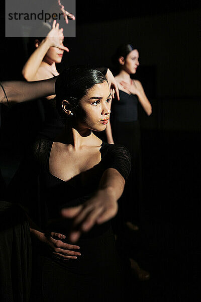Determined flamenco dancer performing in studio