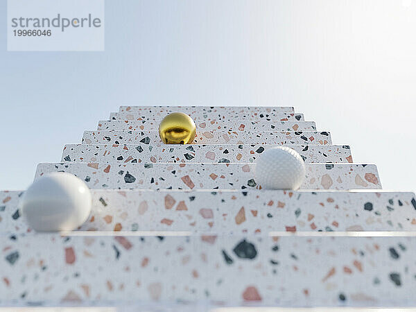 3D-Darstellung von Kugeln auf einer Terrazzo-Treppe
