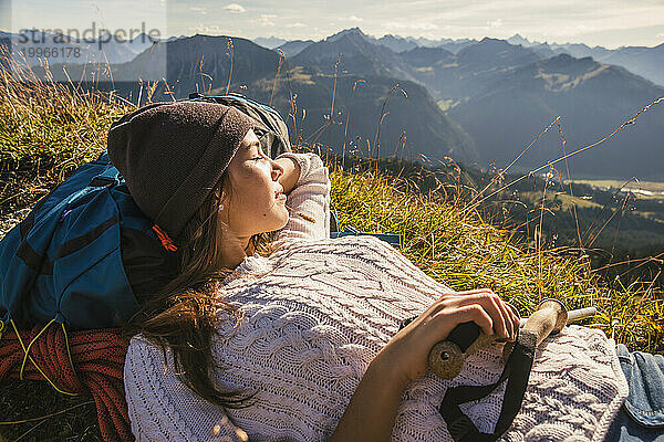 Backpacker resting on mountain in Tannheimer Tal  Tyrol  Austria