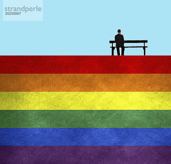 Mann sitzt auf einer Parkbank auf einer Regenbogenflagge