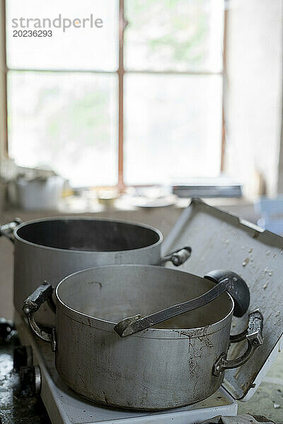 Two cooking pots inside kitchen