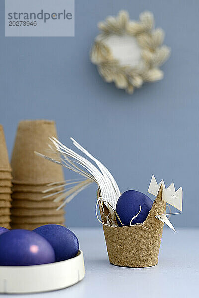 Purple Easter eggs and hen made of biodegradable flower pot