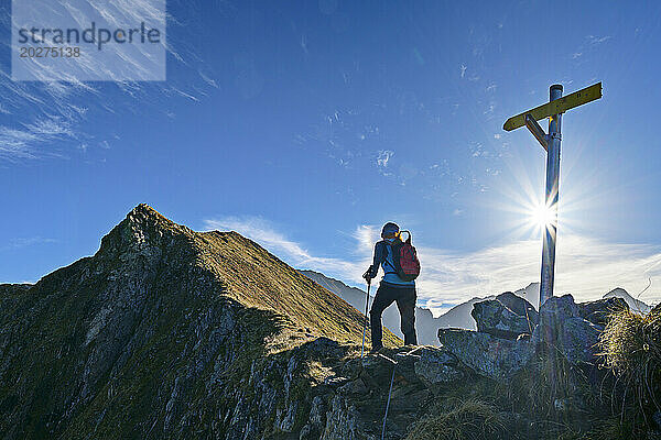Austria  Tyrol  Female hiker following Aschaffenburger Hohenweg trail in Zillertal Alps