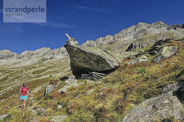 Austria  Tyrol  Female hiker following Aschaffenburger Hohenweg trail in Zillertal Alps