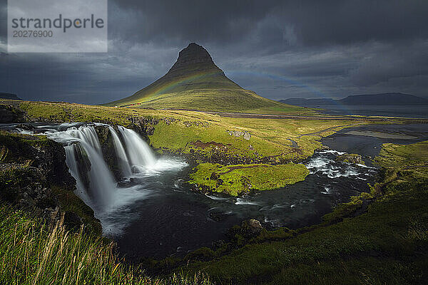 Iceland  Vesturland  Rainbow over Kirkjufellsfoss waterfall