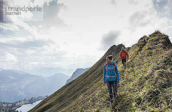 Hikers moving down on mountain at Bavarian Alps in Germany