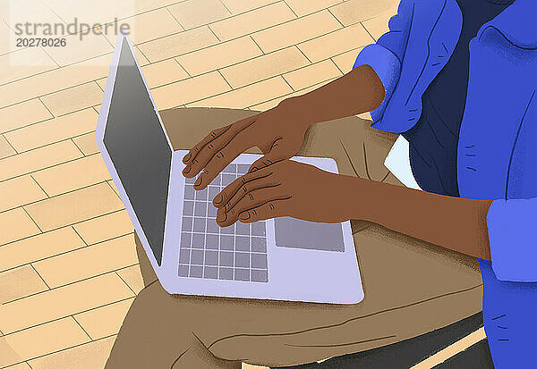 Student tippt und lernt am Laptop