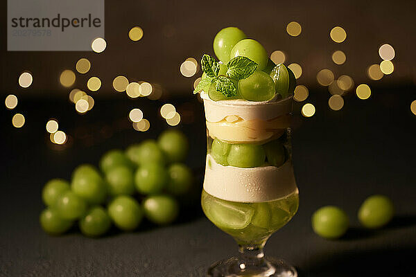 A dessert with green grapes and ice cream