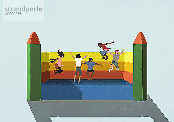 Happy  carefree kids playing  jumping in bouncy castle