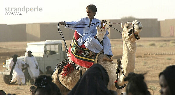 A Toureg child rides atop his camel  Gao  Mali  West Africa