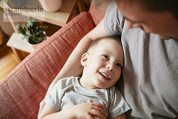 Father and son spending leisure time at home