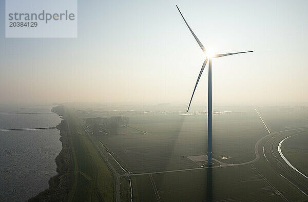 Wind turbine in morning field at Netherlands