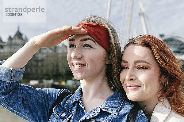 Smiling friends enjoying in London city on sunny day