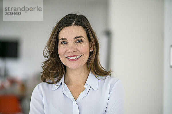 Confident businesswoman in creative office