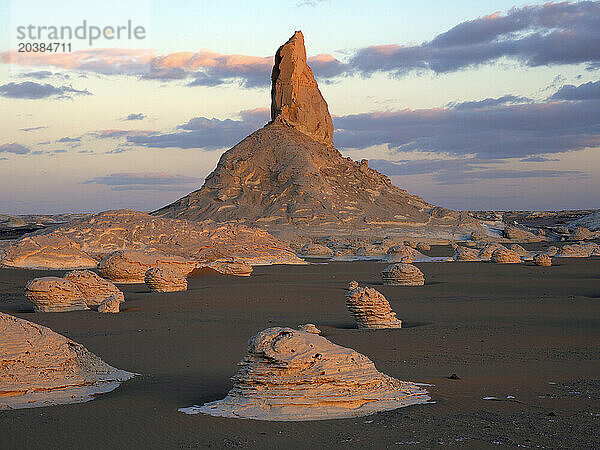 Limestone rock formations under cloudy sky in Sahara desert  Egypt
